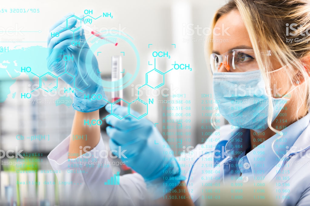 Young attractive female scientist researching in the laboratory with futuristic scientific air interface with chemical formulas and research data in the foreground